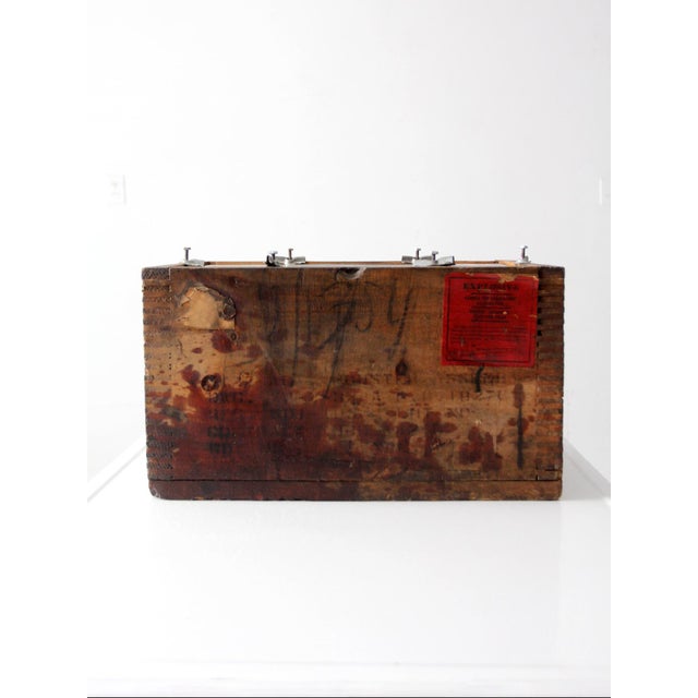 An early industrial wood crate with dovetailed corners, original stenciling, and a bold red “explosive” laboratory label....