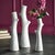 A trio of delicate faux bois stoneware vases are the perfect little accent for shelf or desk. Add some permanent blooms or...