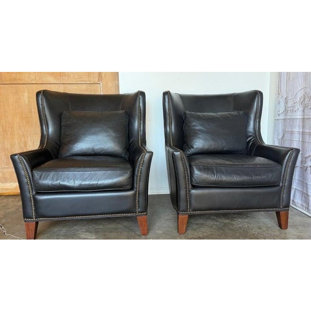 An iconic and highly desirable pair of vintage black leather wingback lounge chairs by Thomasville - Where Style Lives,...
