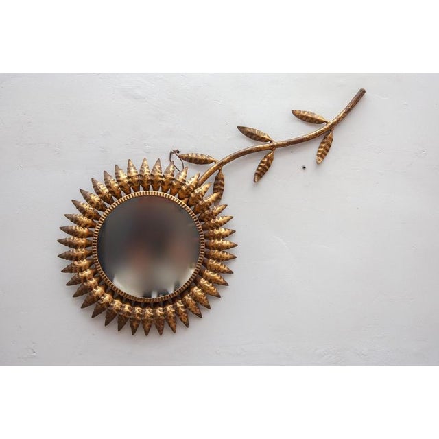 Beautiful Flower style Sunburst mirror, designed and hand made of copper, wood and a convex mirror, France, 1950s. A very...