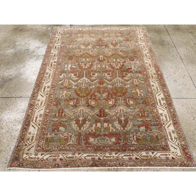 An antique Persian Malayer accent rug handmade during the early 20th century. Measures: 4' 7" x 6' 5"