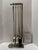 Eichholtz Ennell fireplace set with four tools: brush, tongs, poker, and shovel, plus coordinating stand. Polished nickel...