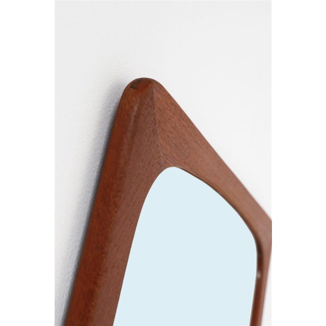 1960s Danish wall mirror. Restored solid teak frame. High-quality craftsmanship. Dimensions: approx. 63 x 36 x 1 cm...