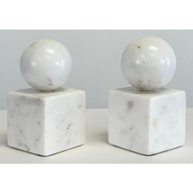 Vintage pair of alabaster bookends featuring strong block bases with sphere tops. Wonderful as bookends or as decorative...