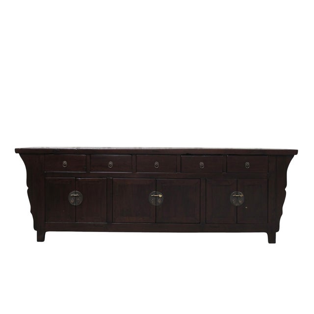 This mid-19th century elm sideboard is made from solid elm wood with a deep, dark brown lacquer finish. The flat...