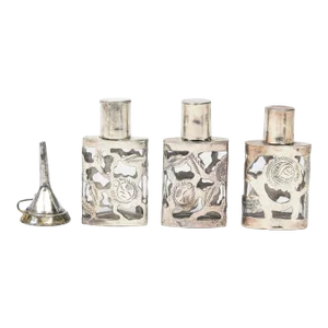 Mid 20th Century Set of Three Mexican Floral Sterling Silver Overlay Perfume Bottles With Funnel