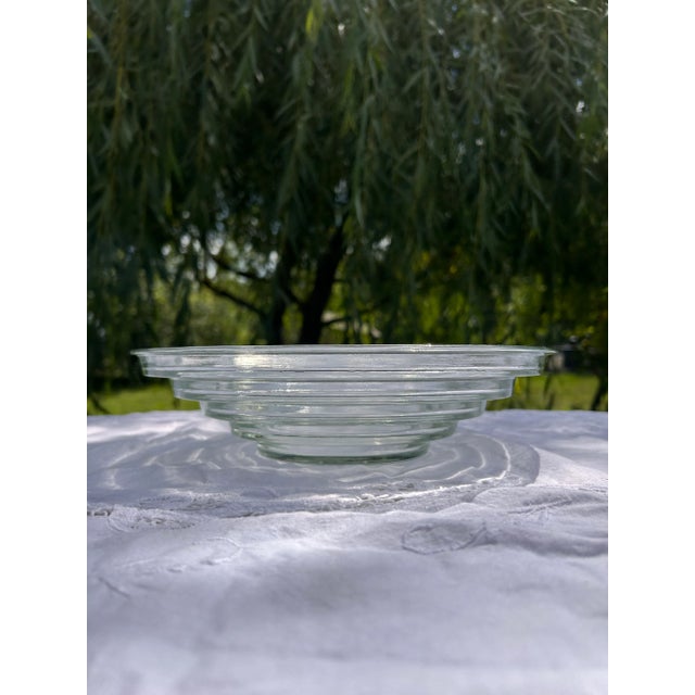 This stunning seafoam green glass bowl replicates Walter Dorwin Teague's iconic Steuben style lens bowl from the 1930s....