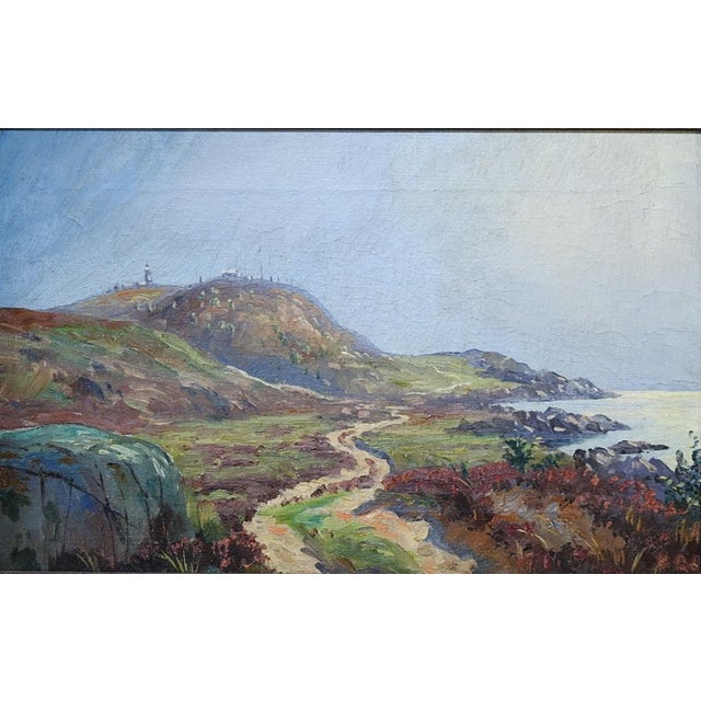 Early 20th century oil on canvas painting of a remote coastal landscape with dirt road and small village in background....