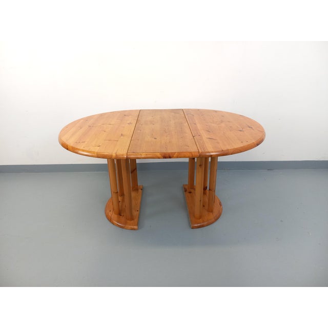 Vintage Scandinavian round table from the 1960s/70s, made of pine, in the style of Danish designer Rainer Daumiller for...
