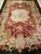This late 19th-century French Aubusson rug is a masterclass in romantic color and classical design. The eight-lobed...