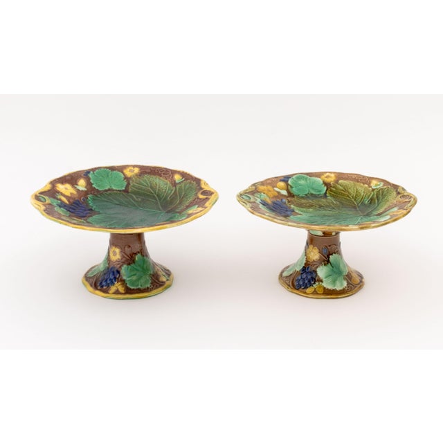 Collection of Sixteen Pieces of English Majolica Strawberry and Grape Leaf Motif Tableware, comprising: six (6)...