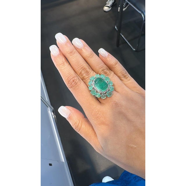 A very gorgeous and beautiful, Emerald Dome Ring set in 18K White Gold & natural Diamonds. The weight of the odd shaped...