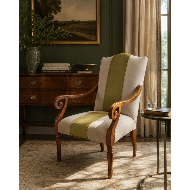 An elegant and beautifully reupholstered arm chair attributed to Baker Furniture’s Milling Road collection, blending...