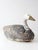 A mid-century swan decoy featuring a lightweight foam body with a carved head and neck, finished in a heavily weathered...