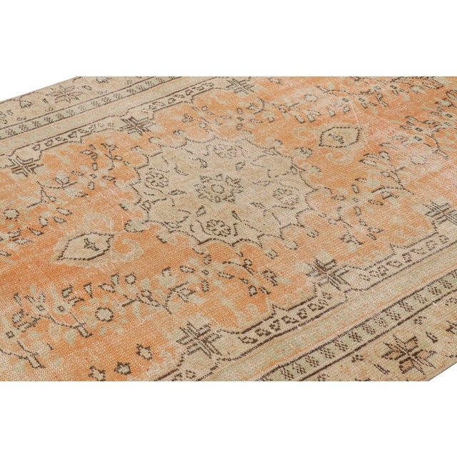 Hand-knotted in wool, this 6x10 vintage Turkish rug is from that collection of mid-century rugs with antique washes giving...