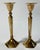 Large elegant brass candle holders with hex bases and angular columns. Topped by fluid tulip shape to hold single taper...