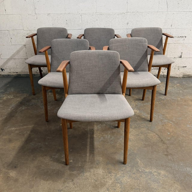 This set of six Danish dining chairs designed by Hans Olsen perfectly captures the essence of Danish mid century design....