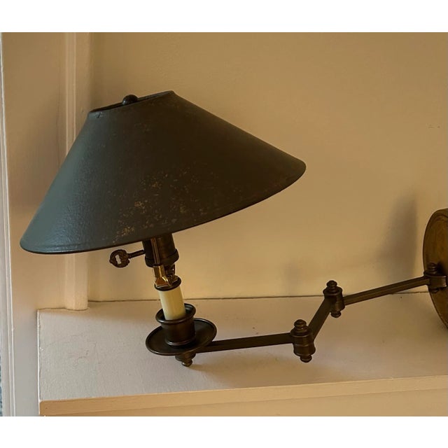 Very cool authentic 1960’s patinated unvarnished brass swing arm lamp with brass cast mounting plate. Very cool original...