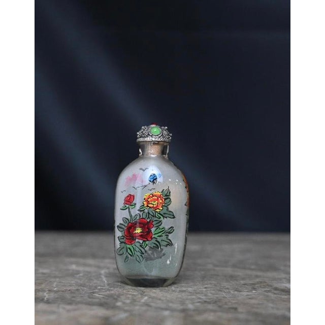 Inside-painted snuff bottles are highly sought after by collectors worldwide. Their value is determined by factors such as...