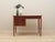 The desk was made in the 1960s in Denmark. The frame and tabletop are covered with teak veneer. The legs are made of solid...