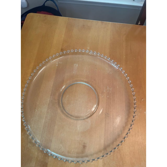 Elegant Imperial Glass Candlewick punch bowl and underplate set, featuring the pattern’s signature clear glass and...