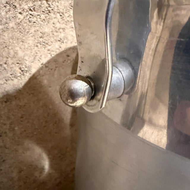 AMBIANIC presents 1960s Italian Wine Cooler Ice Bucket in aluminum and bakelite Marked at the base and numbered B-509 Made...