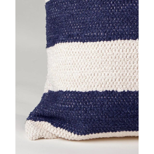 Great, bold, graphic navy blue color block pillow made of 100% re-cycled cotton left over from the fashion industry, from...