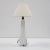 A high-quality table lamp made of beautiful Murano glass in clear, white, and blue. The smooth shape of the glass, curved...