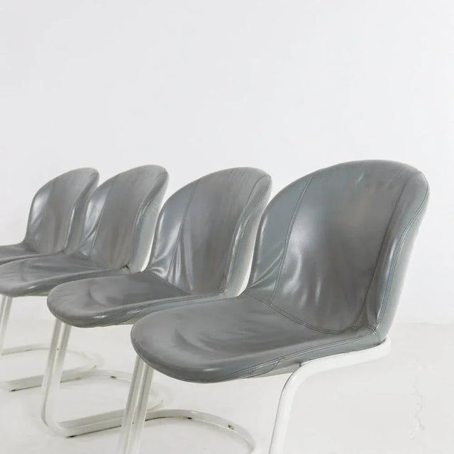 Set of 4 dining chairs by Gastone Rinaldi for Thema Italy. The 1970s chairs feature a white metal frame and are...