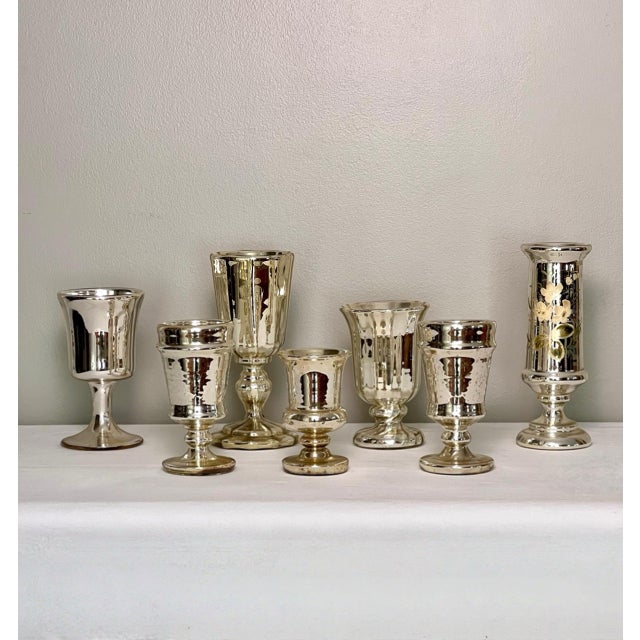 Great collection of seven mercury glass vases ranging from 1880-1920. Beautiful handblown assortment of varying sizes and...
