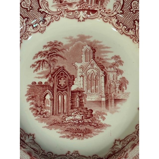 Beautiful red and white bowl depicting abbey ruins manufactured in Maastricht Holland by Petrus Ragouta Company.