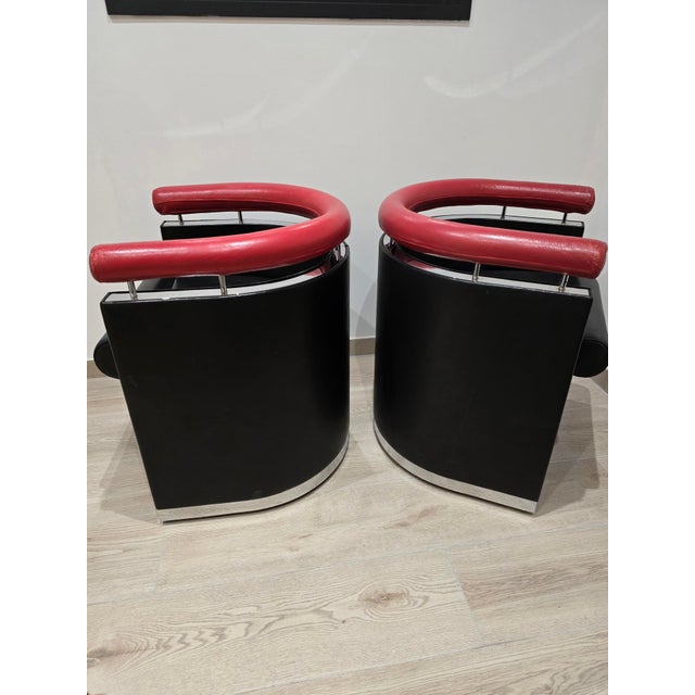 An exceptional pair of designer armchairs, likely dating from the late 1980s/1990s. A particularly rare set, characterized...
