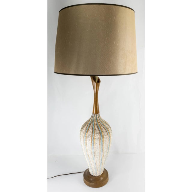 We are selling this nice decorative Mid Century Modern table lamp. This lamp has a popcorn ceramic body with brown blue...