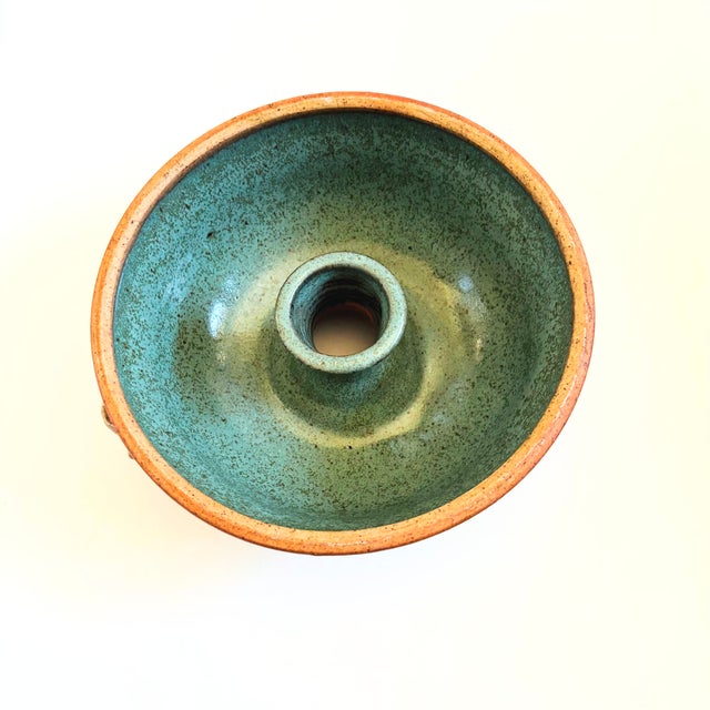 A beautiful vintage studio pottery serving bowl. Speckled earthy exterior glaze with a contrasting turquoise interior....