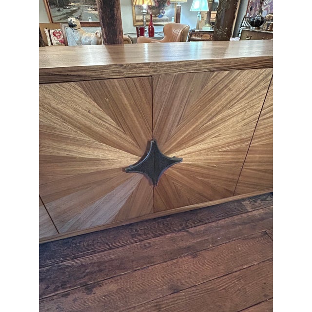 Impressive large yet sleek media cabinet sideboard having gorgeous Paldao veneer in a radiant pattern. There are four...