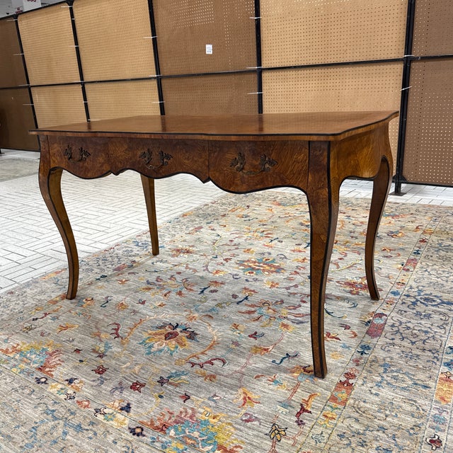 Elegant Italian mid-century burl wood writing desk featuring a beautifully figured burl veneer, graceful Queen Anne-style...