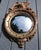 This federalist eagle "bulls eye" convex mirror is a size that will fit well in smaller spaces. It has the 13 dots around...