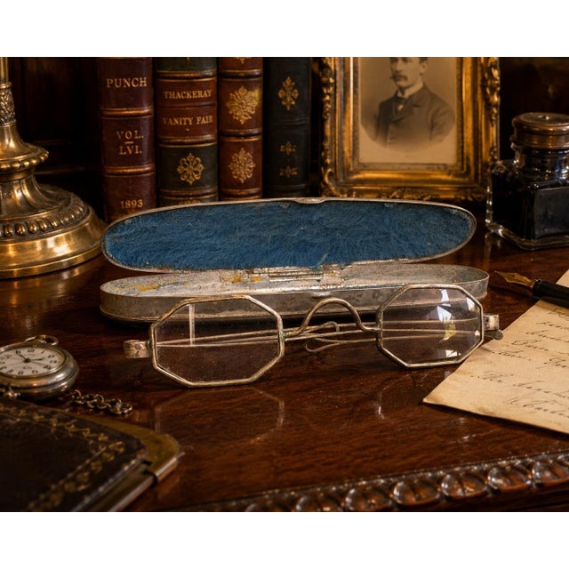 A fascinating and authentic pair of late Victorian to early Edwardian folding reading spectacles, presented in their...