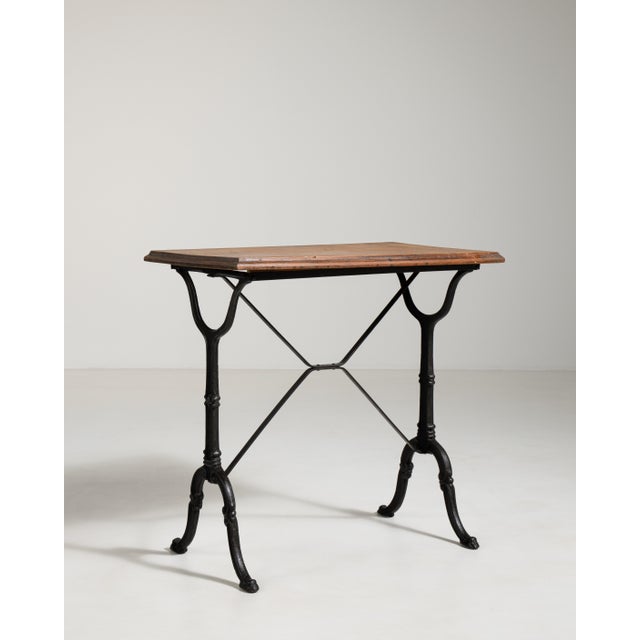 A classic French bistro table featuring a durable cast iron base paired with a simple top. The timeless design originates...