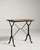 A classic French bistro table featuring a durable cast iron base paired with a simple top. The timeless design originates...