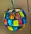 This is a fantastic brutalist style hanging globe made of large chunks of glass fragments in a multitude of colors...