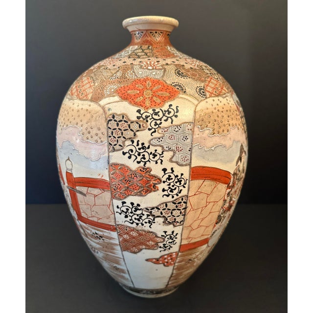 Painted in various shades of orange, red, umber, sky blue, this Chinese vase depicts wise men and their attendants....