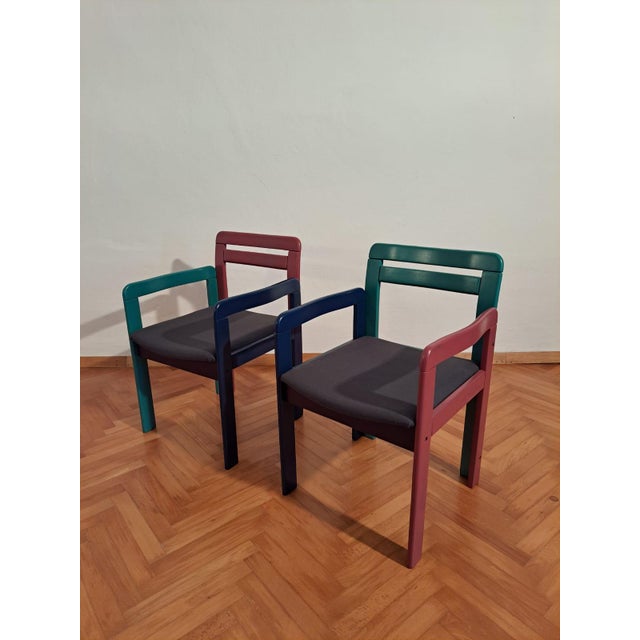 A stunning pair with multicolored chairs and table from the wild decade 1980s. The legs and the back are coated with...