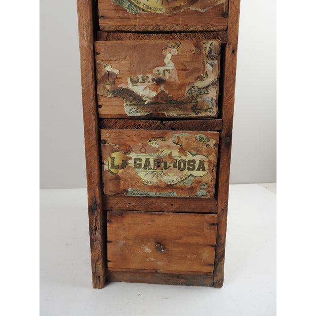 Early 20th century primative folk art handmade set of drawers made from old cigar boxes. Wood frame with drawers made from...