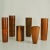 Set of six refined hand turned wooden boxes each in a different specimen in straight and tapered cylinder shape in various...