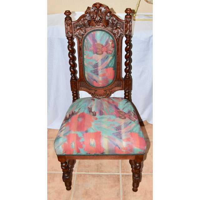 Antique Renaissance Revival carved oak barley twist side chair. Features solid oak wood construction, upholstered front...