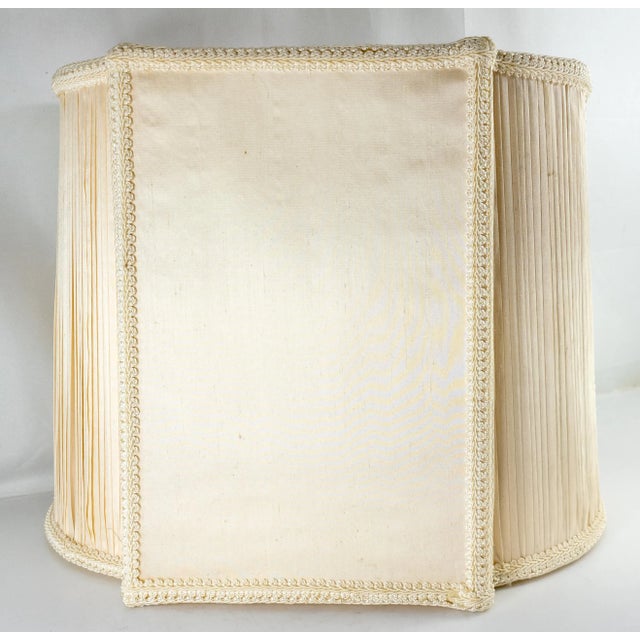 We are selling this very fancy and probably very expensive silk and cotton lamp shade in unique shape, probably came from...