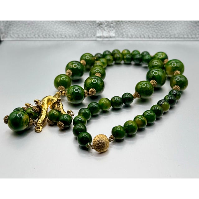 Plastic 1950s Bakelite Pendant Necklace With Green and Yellow Marbled Beads and a Gold Tone Monkey Pendent Holding Beads Excellent Pre Owned Condition For Sale - Image 7 of 12
