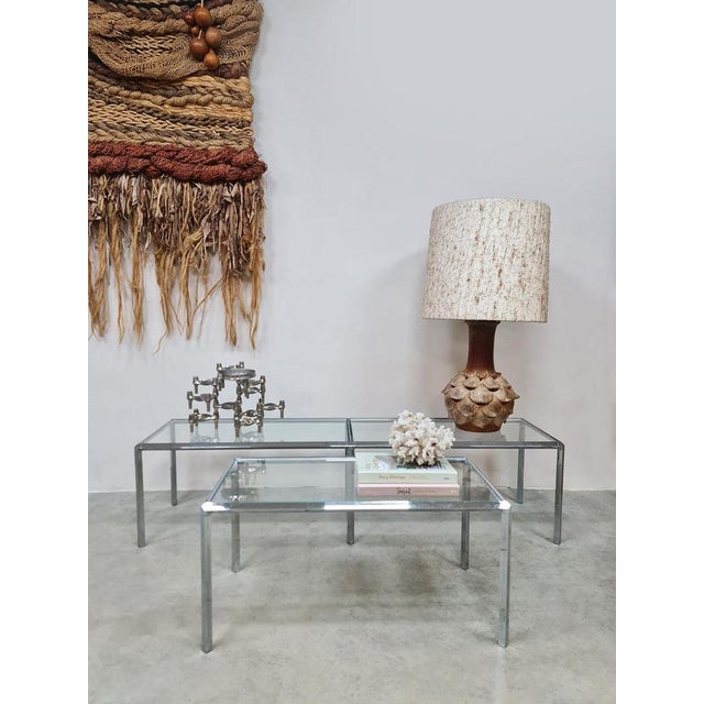 Timeless and sleek, this great minimalist set of side tables. A rare set of 3 chrome side tables/side tables produced by...