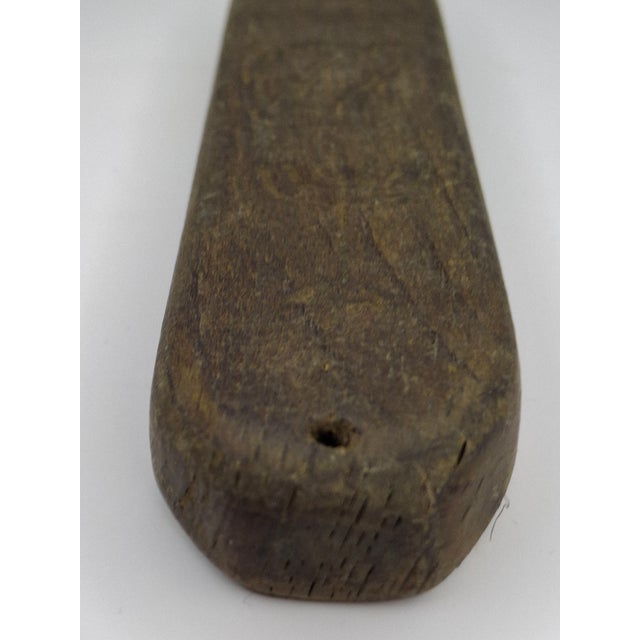 This is a poignant and historically significant hand-carved wooden Mezuzah case originating from the Litzmannstadt Ghetto...